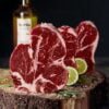 raw meat on brown wooden chopping board